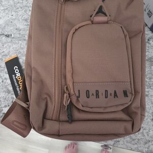 New In Package Tan Crossbody Bag. Very High Quality Material